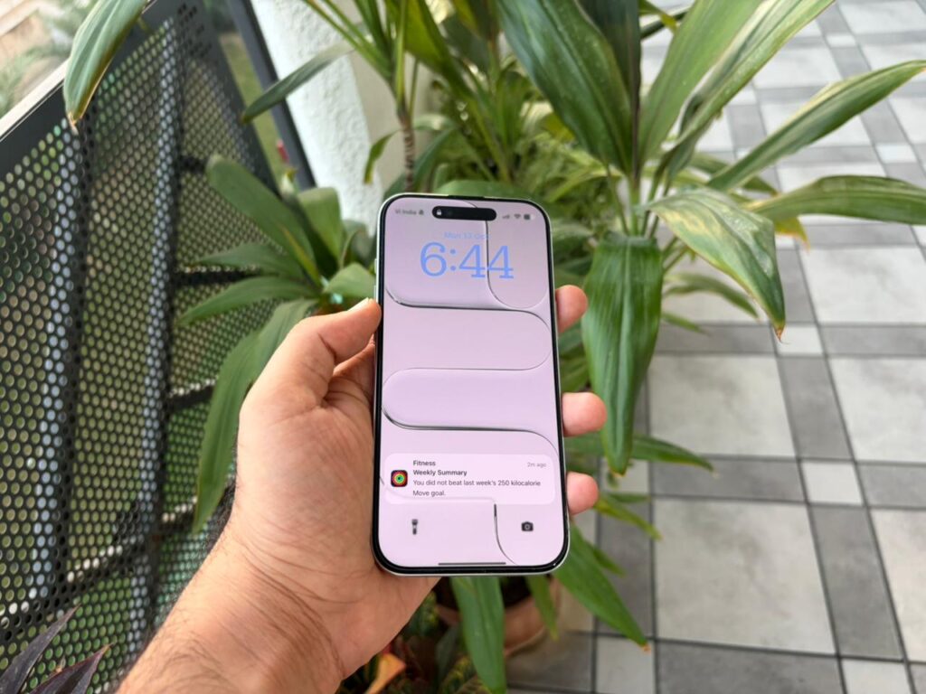 iPhone 17 Air in hand, emphasizing its lightness and premium titanium texture.